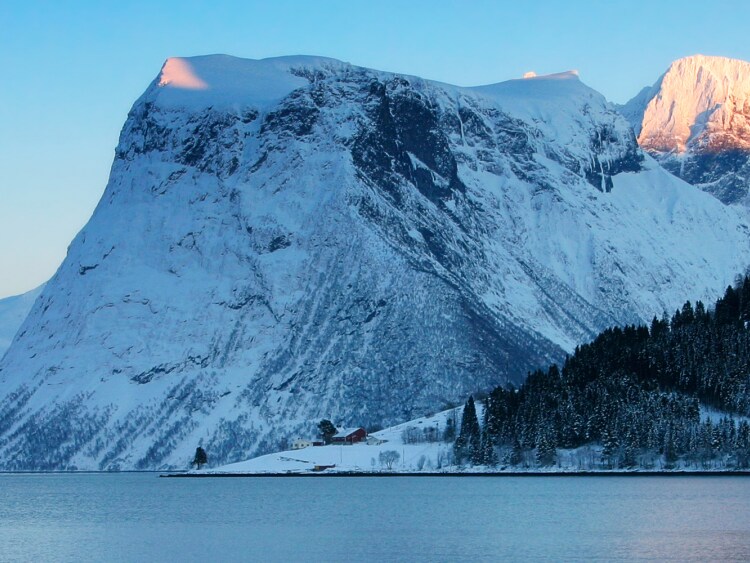 Snowy mountains in Alesund on Norwegian Fjords Cruise Holiday