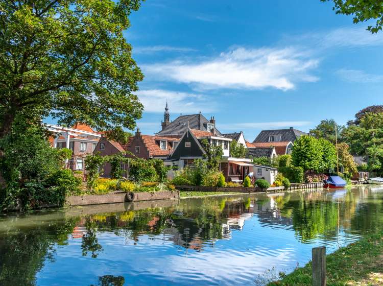 Small houses and bridge at a canal in Edam
