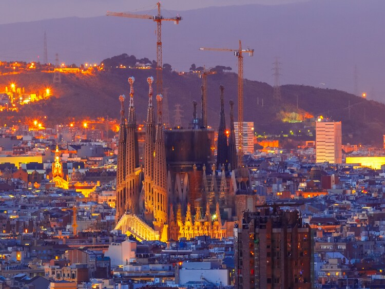 La Sagrada Familia illuminated at night in Barcelona, Spain