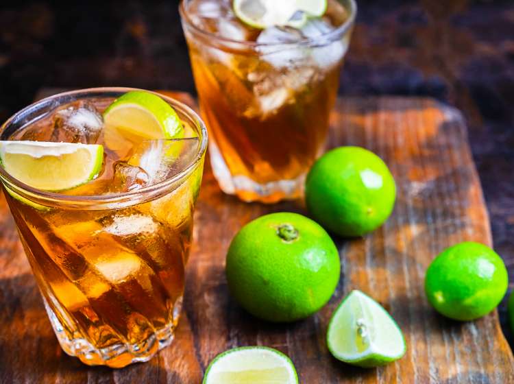 Iced lemon tea and lemon on a wooden table