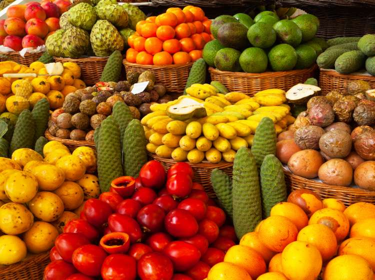 Exotic tropical fruits on the market. Edible bright background