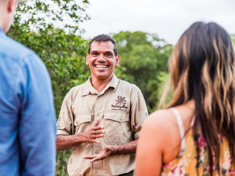 Couple listening to an indigenous guide