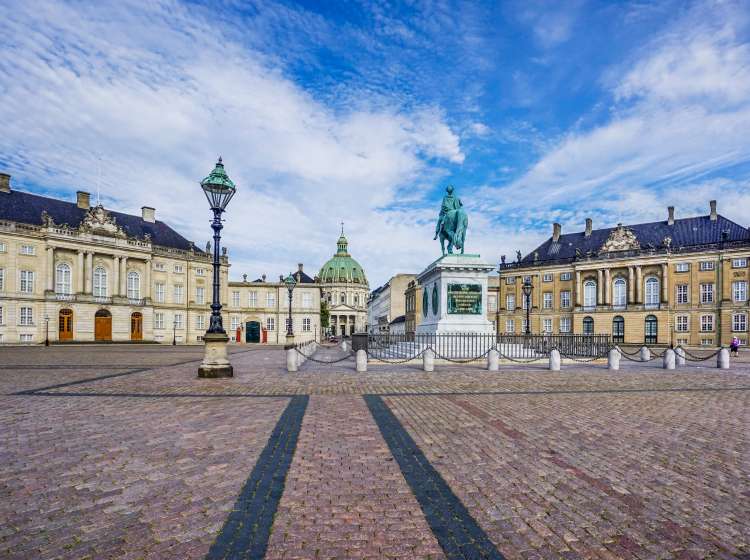 Amalienborg Palace Square (Amalienborg Slotsplads) with the equestrian statue of King Frederick V and the Christian VII's and Christian VIII's Palaces and Frederik's Church in the background, Copenhagen, Zealand, Denmark, July 23, 2016