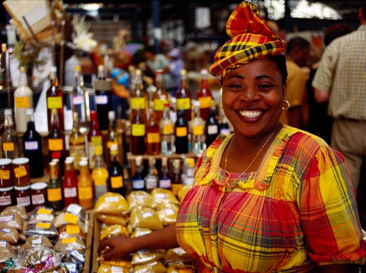 A woman selling spices at the market in Fort-de-France.