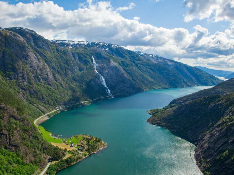 A landscape of the Langfoss waterfall and mountains in Akrafjorden, Norway