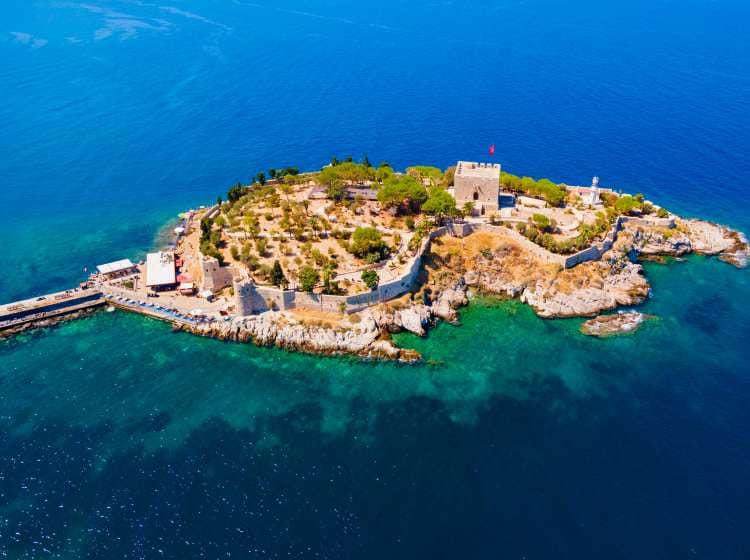 Guvercinada means Pigeon Island aerial panoramic view in Kusadasi city. Kusadasi is located in Aydin Province in Turkey.