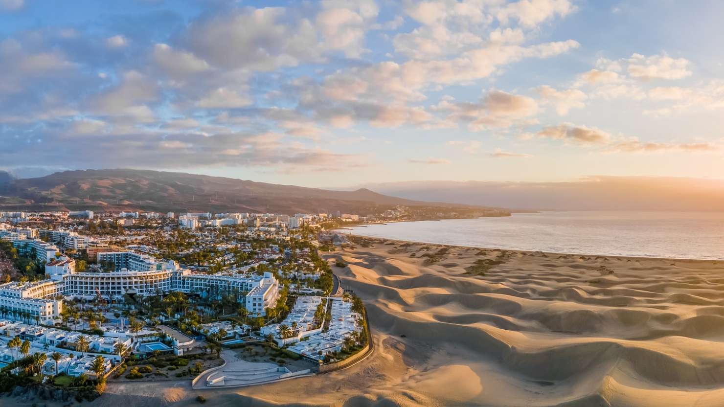 Landscape with Maspalomas town and golden sand dunes at sunrise, Gran Canaria, Canary Islands, Spain