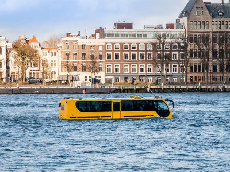 Attraction in Rotterdam, an amphibious vehicle in the river "de nieuwe Maas" that can travel by road and sail like a boat with the appearance of a coach or bus