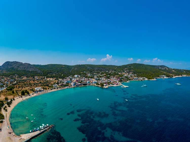 Aegina, Egina, aerial panoramic photo of the town, port and beach of Agia Marina at summer