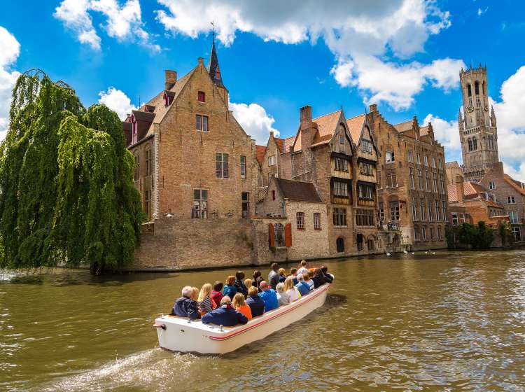 Boat with people on going along a river 