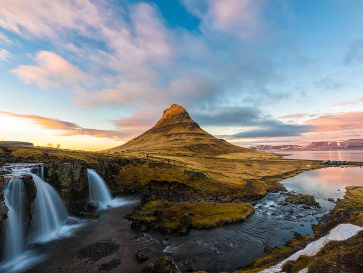Evening long exposure shot at Kirkjufell, Grundarfjordur town, West Iceland with the moving cloud over the mountain ; Shutterstock ID 615889553; Invoice Number: -