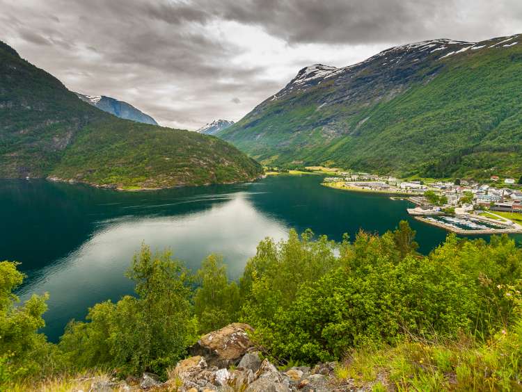A river infront of green mountains