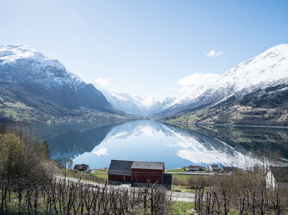 A lake infront of snowy mountains