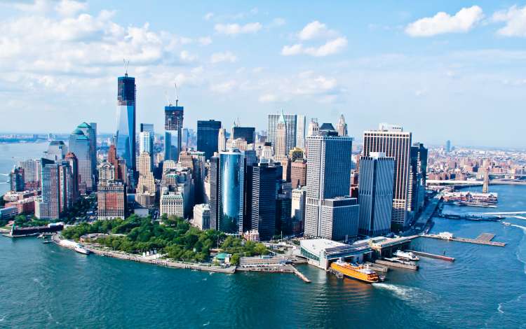 Skyline of New York City surrounded by the Hudson River 