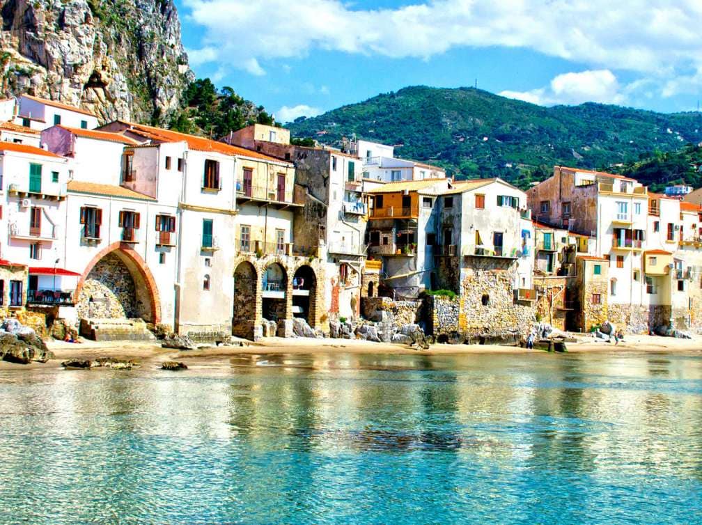 Rustic buildings behind sea in Palermo, Italy