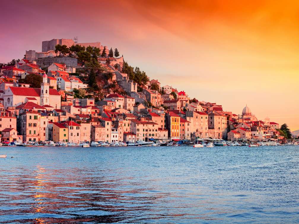 Houses and boats in the harbour in Sibenik, Croatia