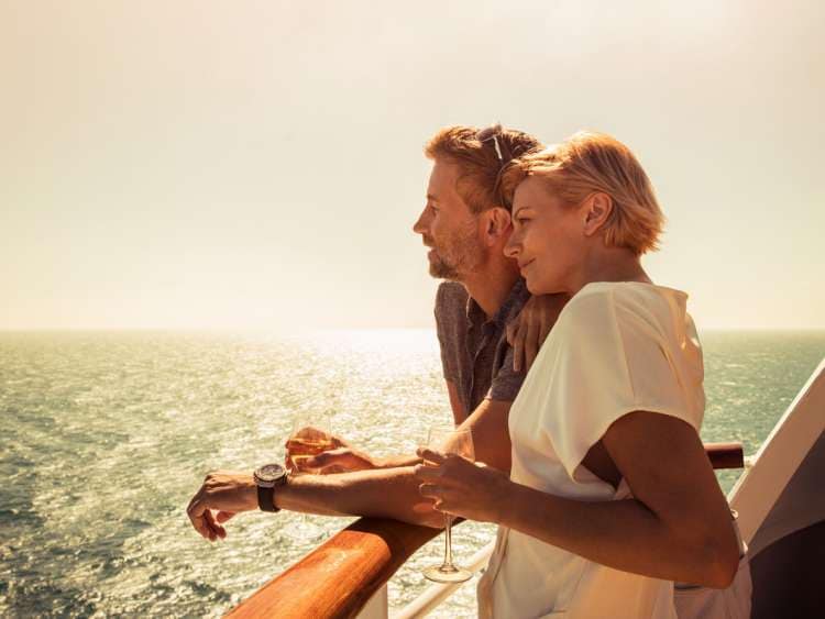 Couple drinking enjoying the sunset