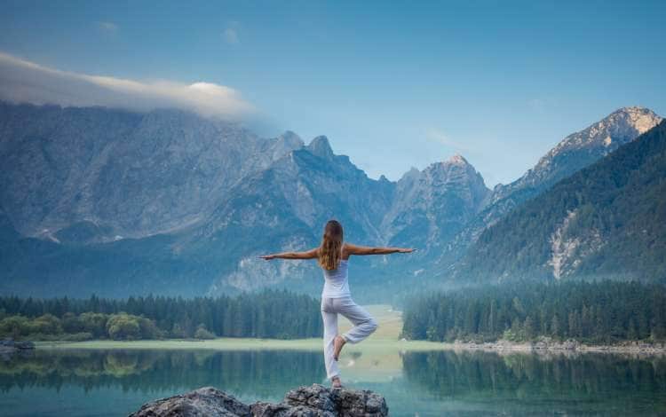 Young beautiful woman doing yoga exercises. Healthy lifestyle concept.