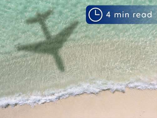 Plane flying over beach in St Maarten