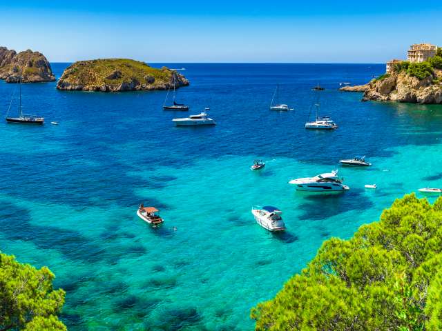 Boats surrounding the shoreline in Mallorca, Spain