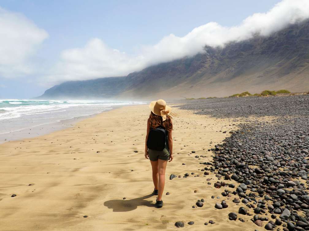 Woman exploring beach in Canary Islands