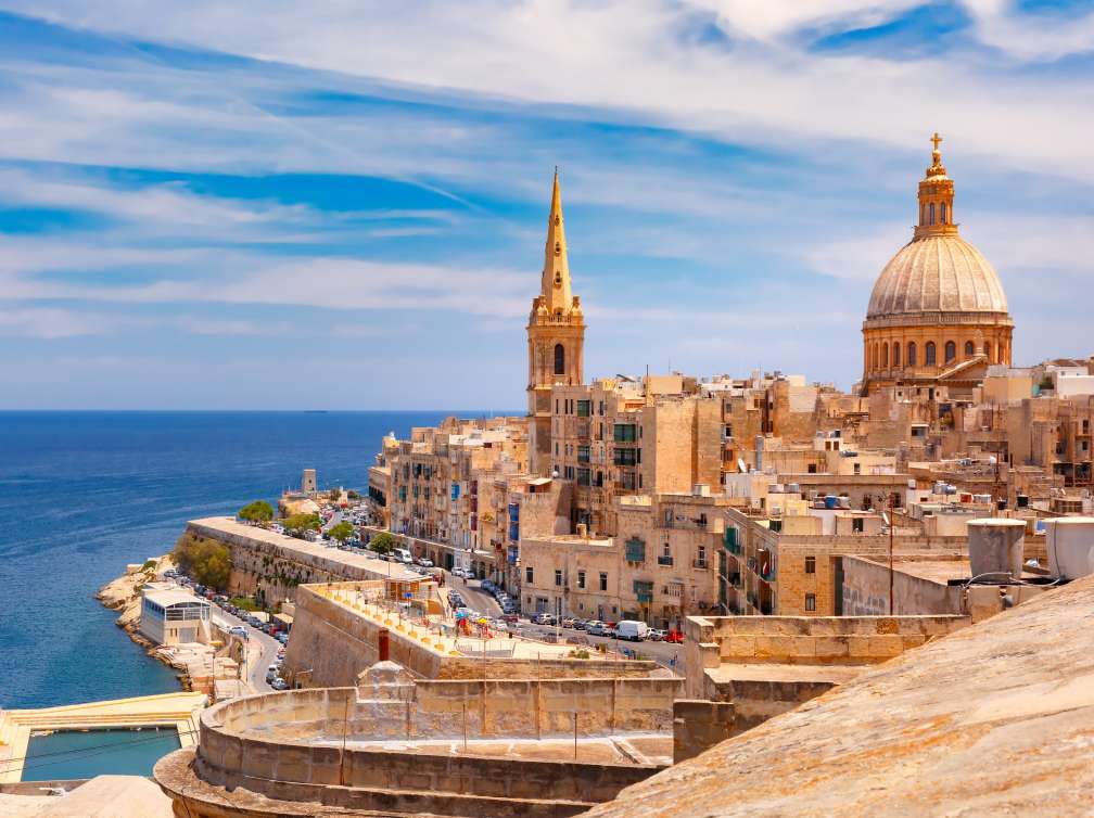 View from above of roofs and church of Our Lady of Mount Carmel and St. Paul's Anglican Pro-Cathedral, Valletta, Capital city of Malta