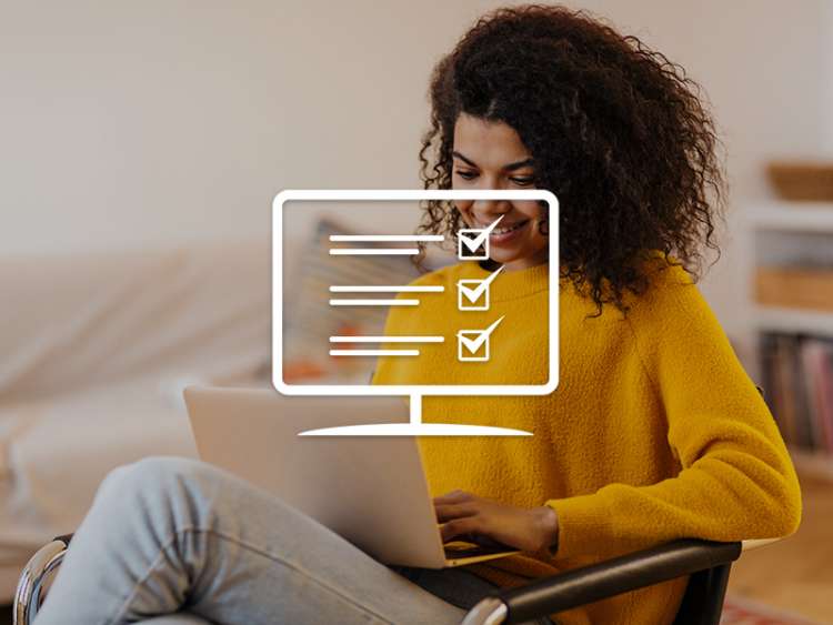 Checklist on a laptop screen with woman in background on her laptop