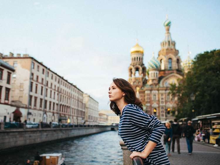 Girl in St. Petersburg with church in background
