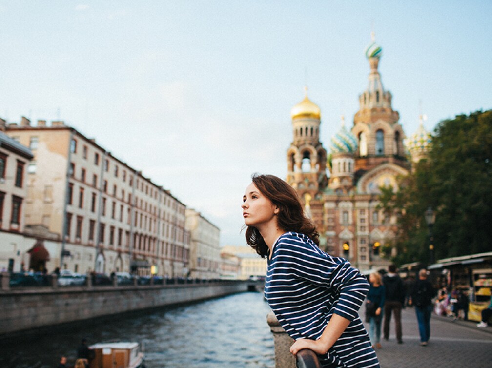 Girl in St. Petersburg with church in background