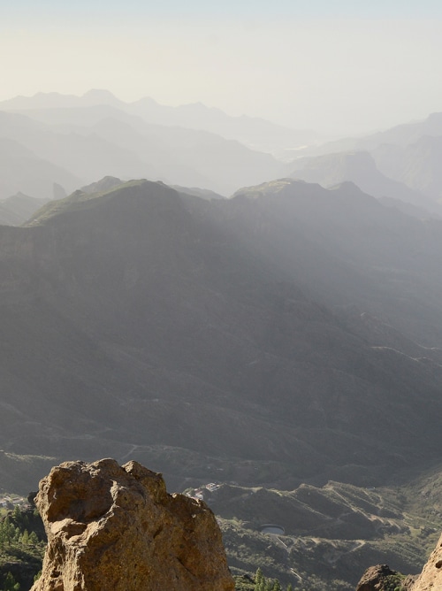 Lady sitting on rock in Gran Canaria