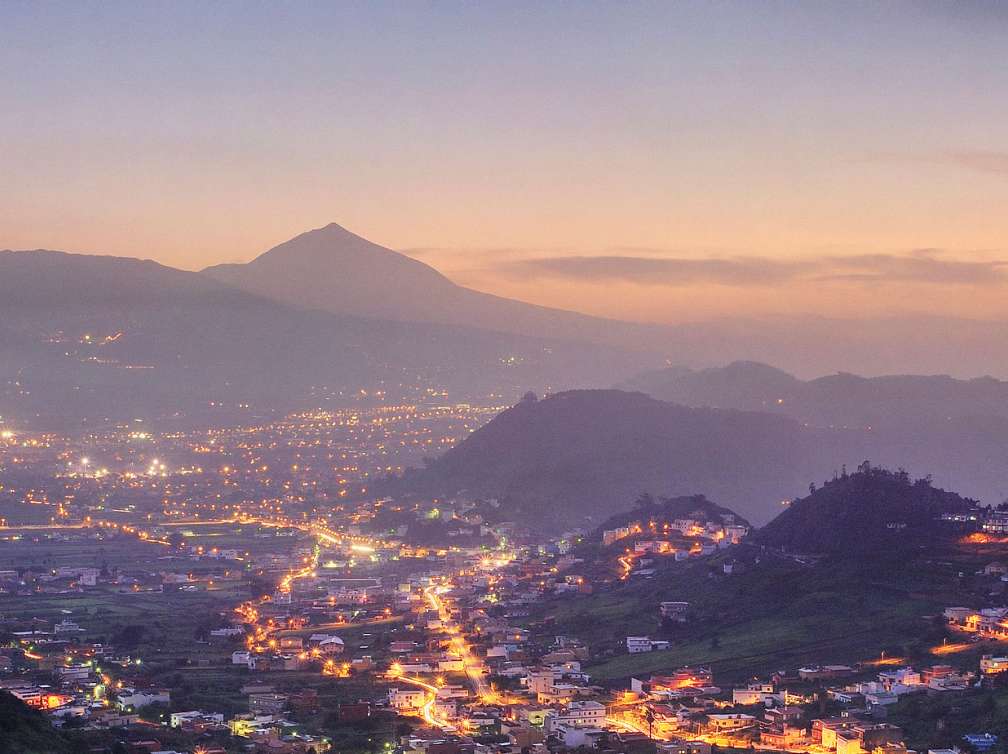  View of a town and mountains in Tenerife at night
