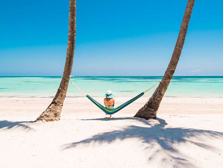 Lady resting on a hammock in Dominica