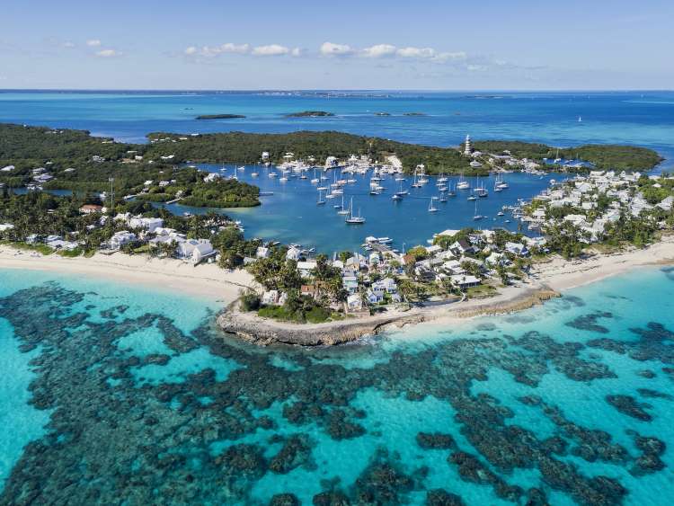 Aerial view of the harbour, beach and lighthouse in Hope Town on Elbow Cay off the island of Abaco, Bahamas.; Shutterstock ID 791782681; project: olly; job: ; client: pocruises; other: 
