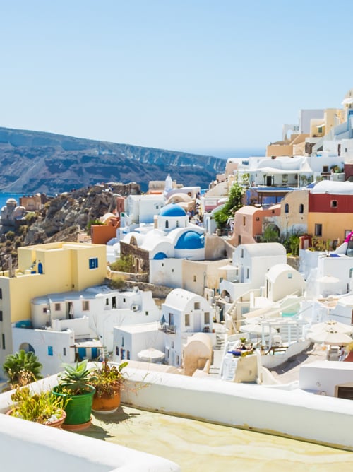 Couple viewing Santorini landscape