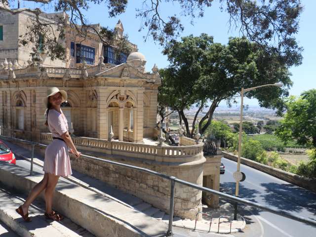 a young european girl in a hat walks through the capital of Malta Valletta; Shutterstock ID 2012435648; project: x; job: y; client: ; other: 