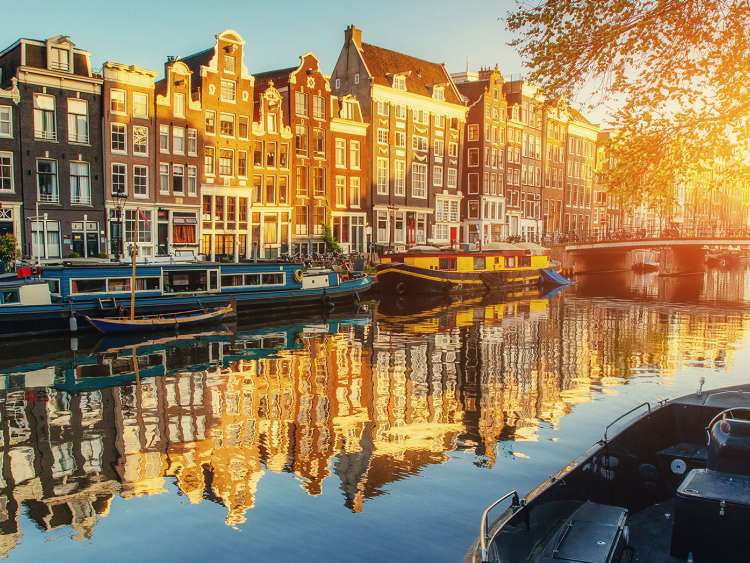 View of sunset over canal in Amsterdam