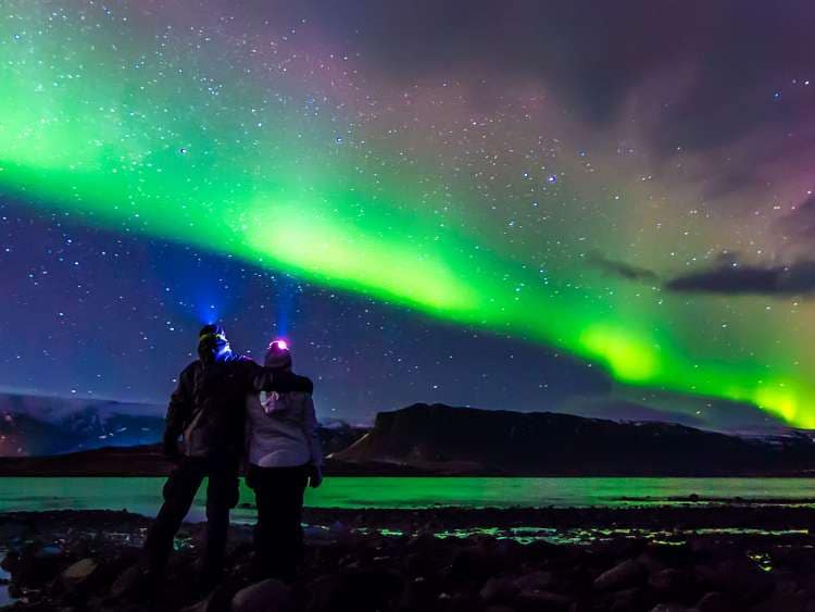 A couple observing the Northern Lights