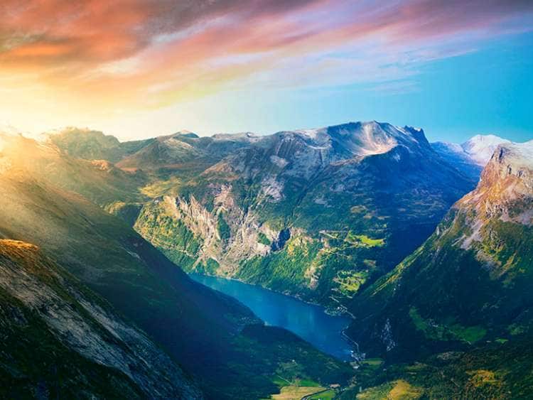 River running between two mountains in Geiranger in Norway