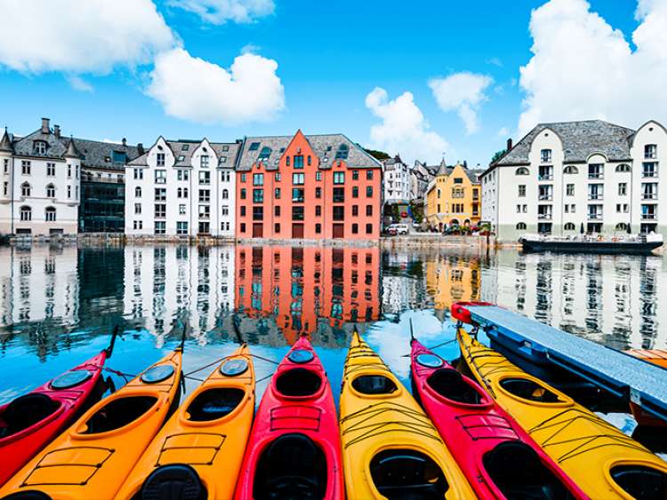 Kayak boats and coloured buildings in Alesund