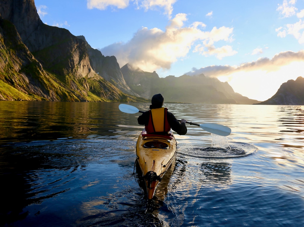Person canoeing in the Norwegian Fjords