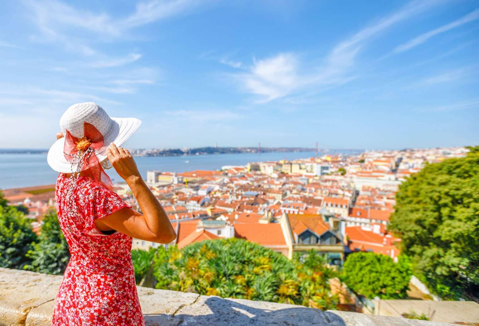 Women in hat exploring Lisbon, Portugal