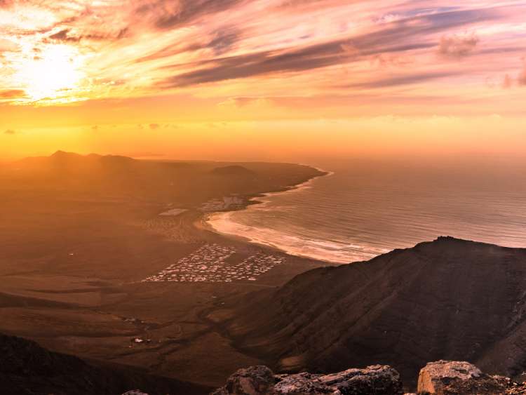 Amazing summer sunset panorama over ocean resort beach Famara Lanzarote Canary Islands, Spain; Shutterstock ID 1467800183; Project: Adobe