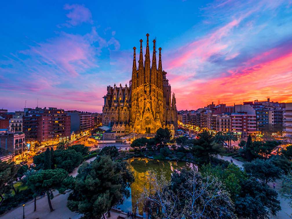 Sagrada Familia church in Barcelona with red sky in the background