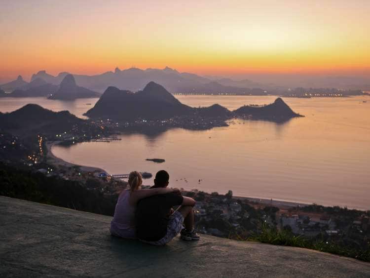 Couple looking at sunset, Rio de Janeiro.