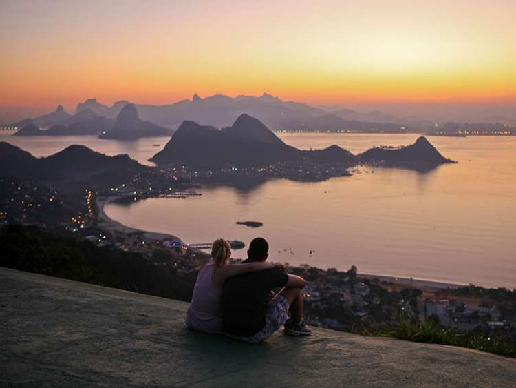 Couple viewing Rio landscape during sunset