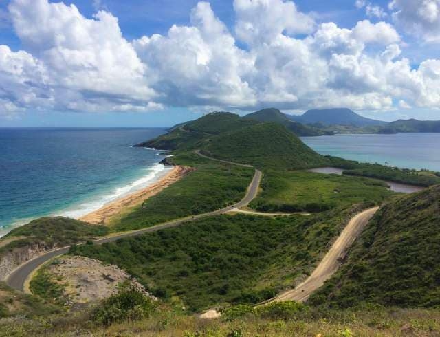 Panoramic Amazing view from the top of Timothy Hill that includes the Atlantic Ocean, the Caribbean Sea, Friar’s and Frigate bays, Nevis, and the hilly peninsula itself.