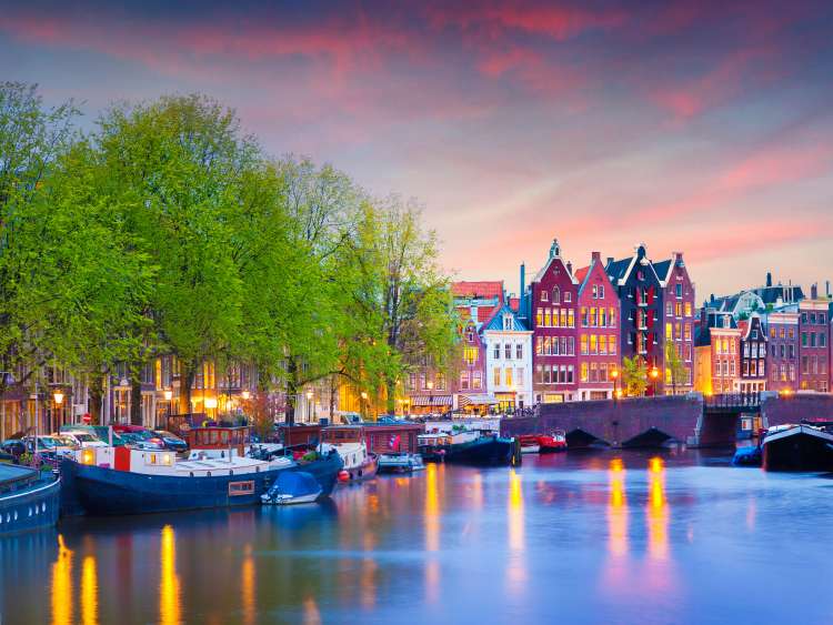 Boats moored in Amsterdam canal