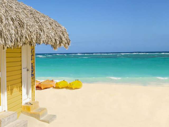 Yellow beach hut on beach in Barbados