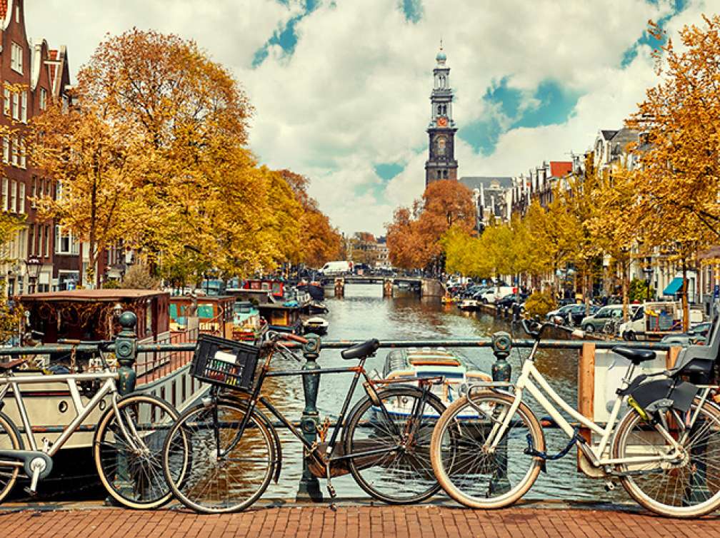 Bikes tied up on Torensluis bridge over the canal in Amsterdam