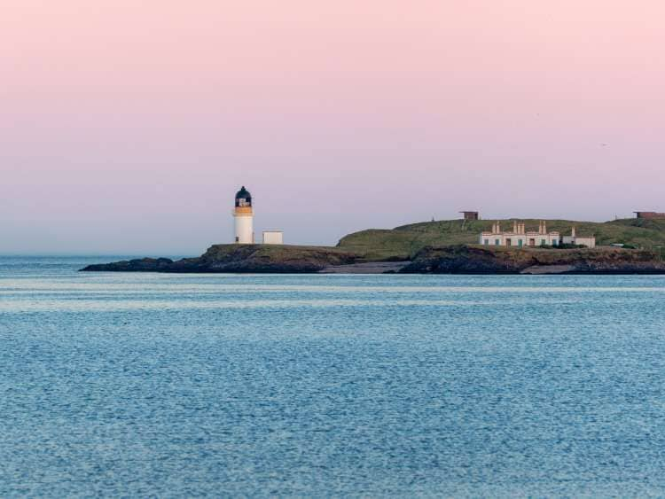 Arnish point lighthouse at sunset, pink sky, Isle of Lewis, Outer Hebrides, Scotland